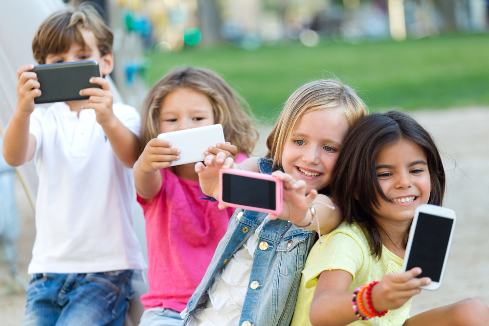 group-childrens-taking-selfie-park